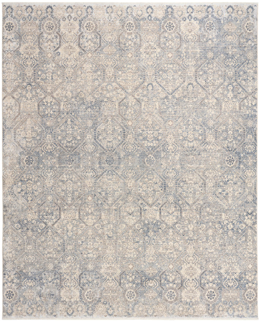 Rectangular distressed blue and beige oriental-style area rug with faded geometric floral medallions.