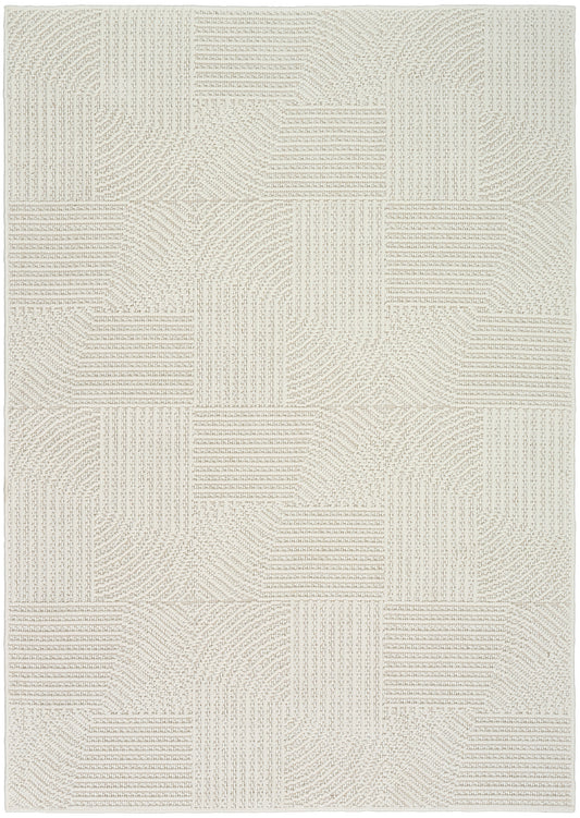 Rectangular cream-beige textured woven rug with geometric patchwork blocks and ribbed line patterns.