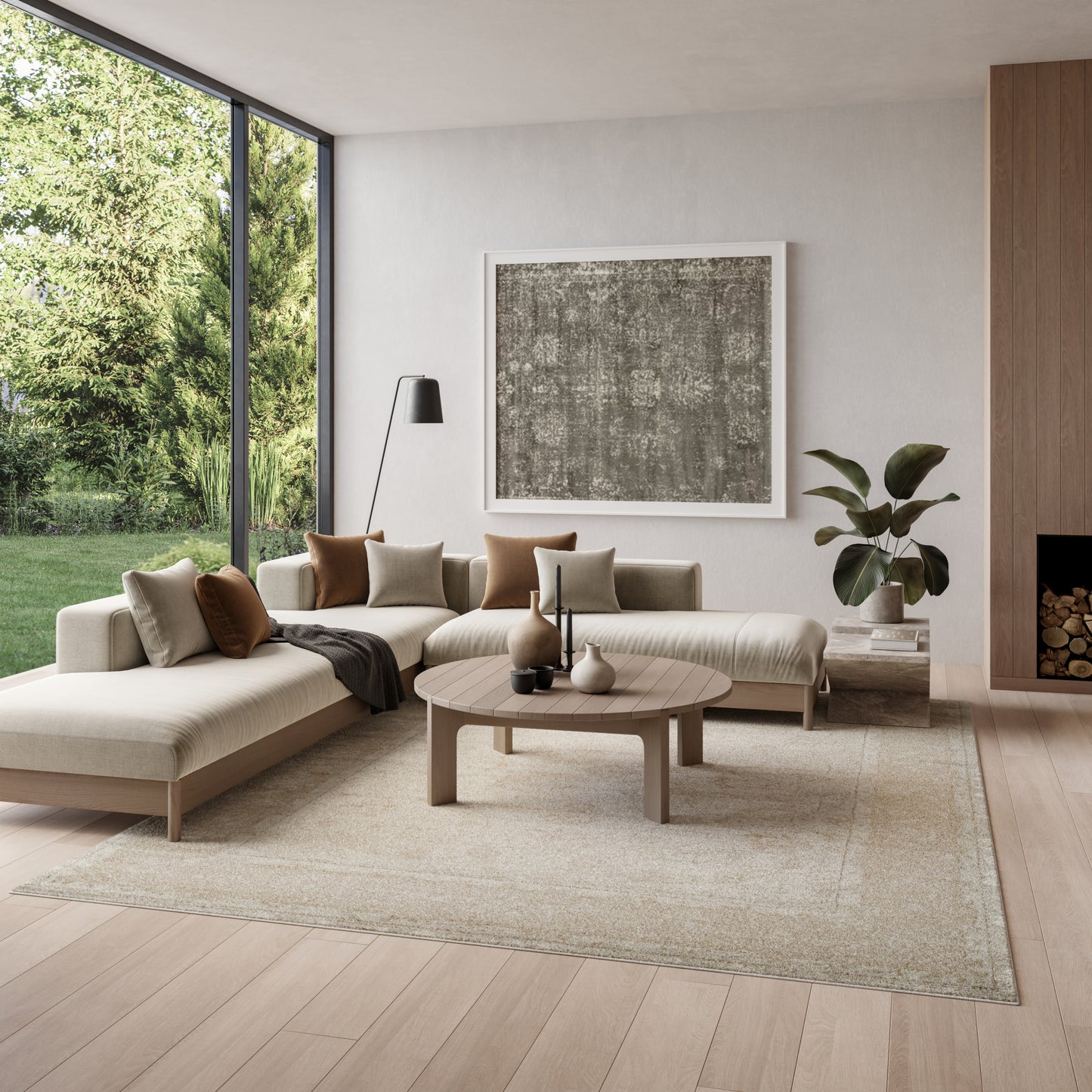 Neutral living room with beige L-shaped sofa, round wood coffee table, gray abstract art, and a floor-to-ceiling window view.