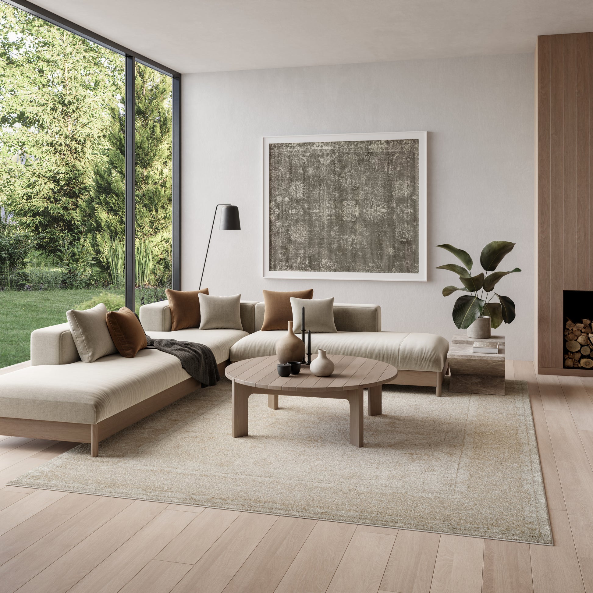 Neutral living room with beige L-shaped sofa, round wood coffee table, gray abstract art, and a floor-to-ceiling window view.