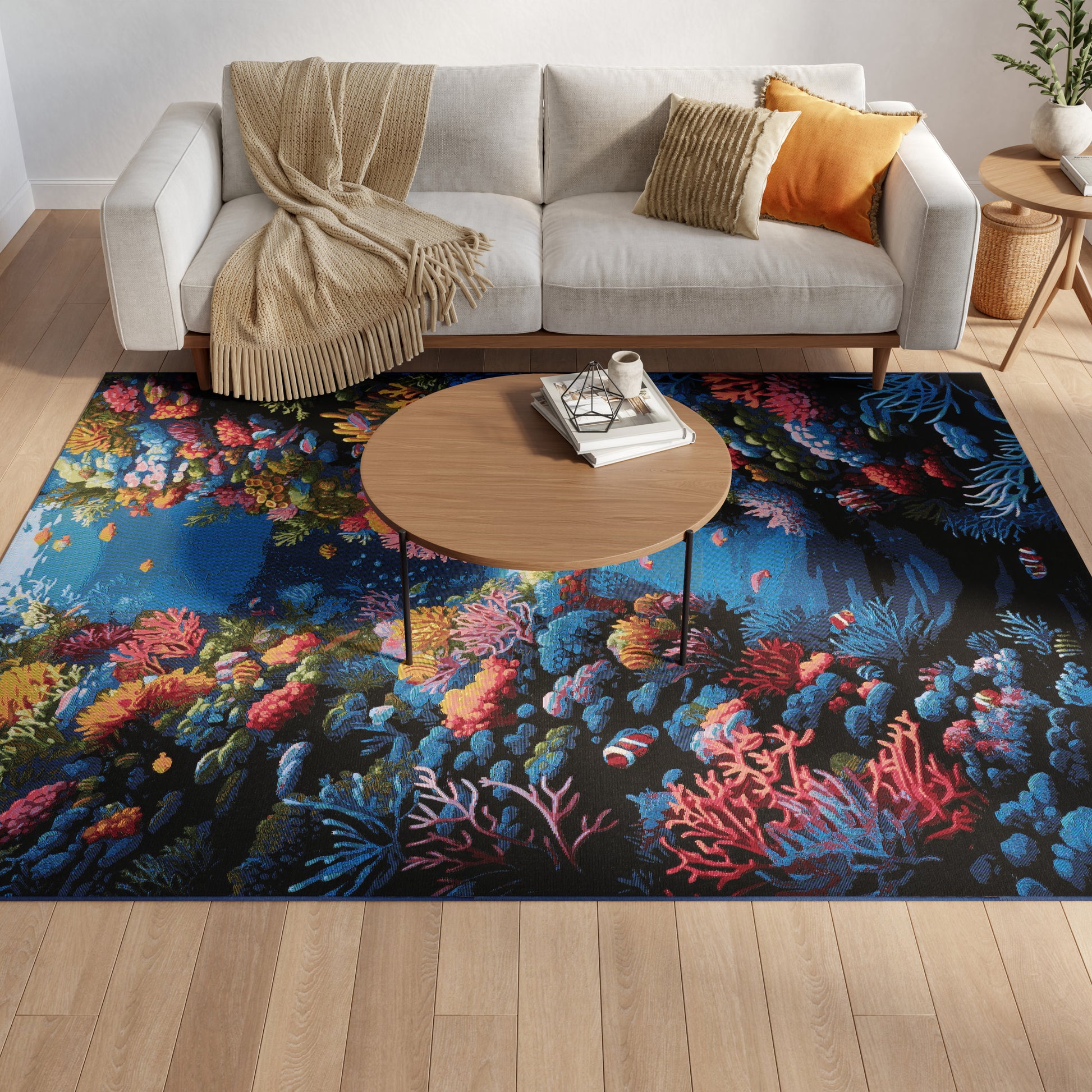 Beige sectional sofa with tan and orange cushions and cozy throw, round wood coffee table on a vibrant coral reef rug.