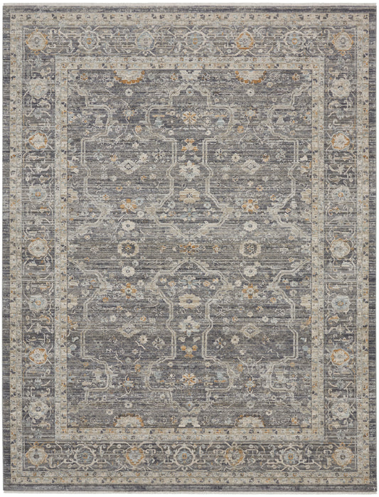 Distressed grey-blue Persian-style area rug with ivory border and subtle gold floral motifs.