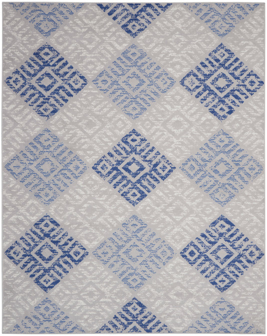 Rectangular rug with blue and light-blue diamond motifs on a light gray background; geometric concentric-squares pattern.