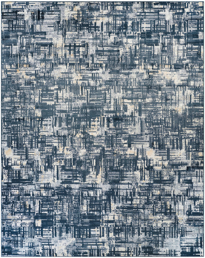 Abstract blue area rug with a distressed geometric pattern in navy, light blue, and cream tones.