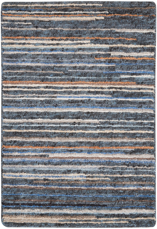 Blue-gray striped shag rug with white and orange accents; soft, thick textured pile.