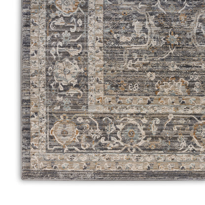 Close-up of a rectangular distressed traditional runner rug with gray, cream and blue floral border and ornate pattern.