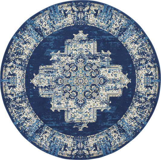 Circular navy blue rug with an ivory and light-blue central medallion and ornate border in oriental design.