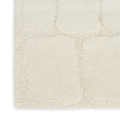 Cream textured rug with a subtle square-grid pattern; soft, dense pile for living rooms.