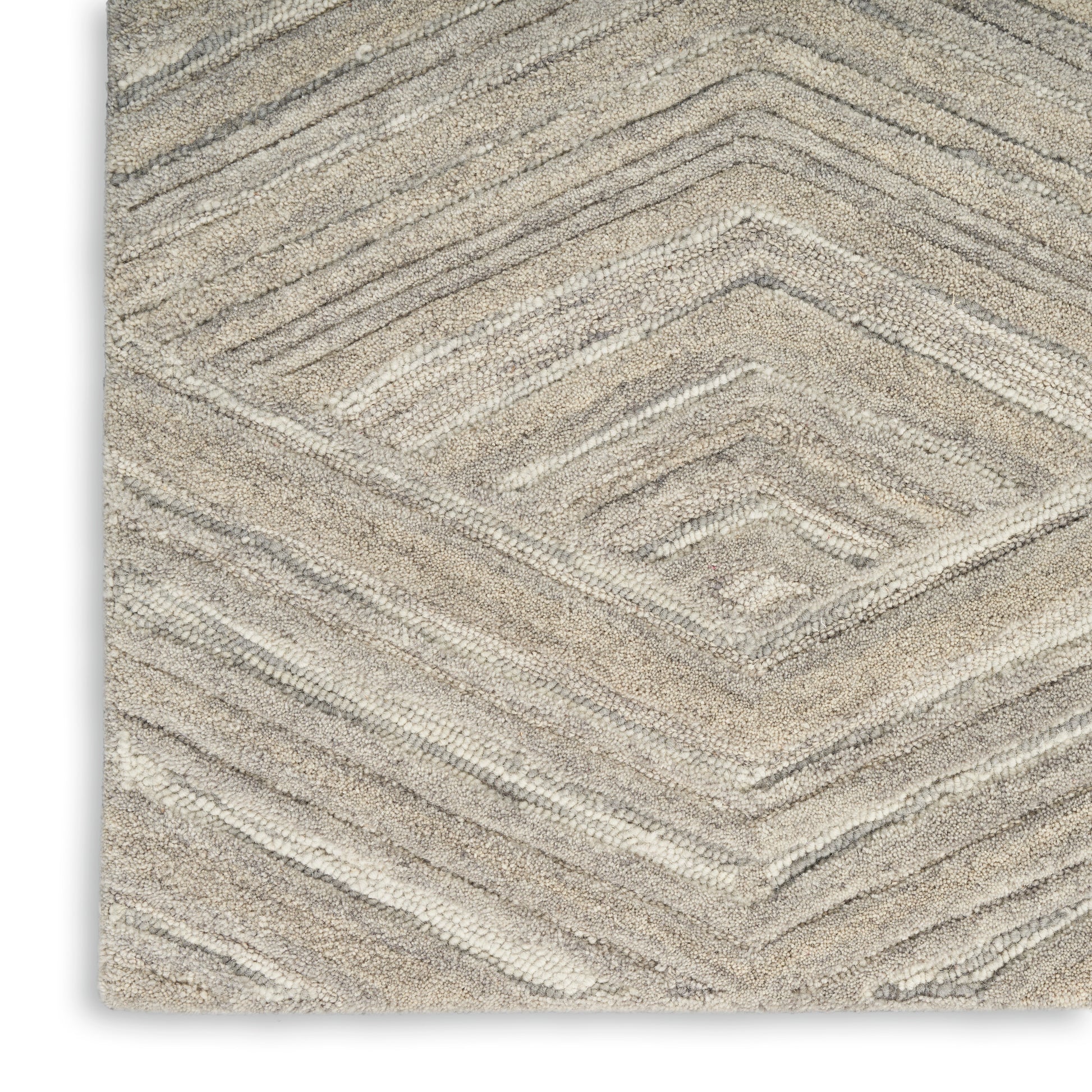Beige textured runner rug with stepped chevron diamond pattern and plush pile.