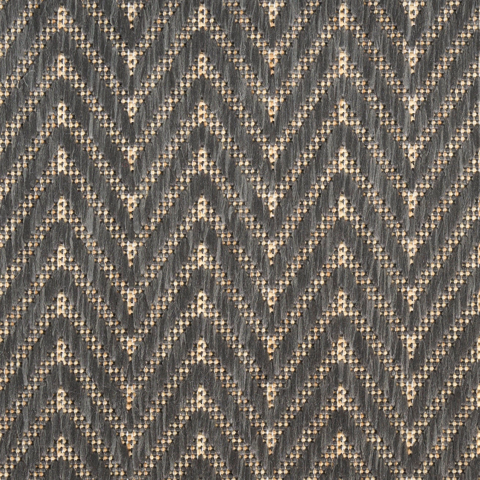Dark grey & cream chevron-knit rug with a dotted zigzag pattern; textured geometric rug.