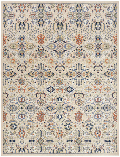 Cream-toned Bohemian rug with blue, orange & pale green floral motifs in a symmetric pattern, 9' x 12'.
