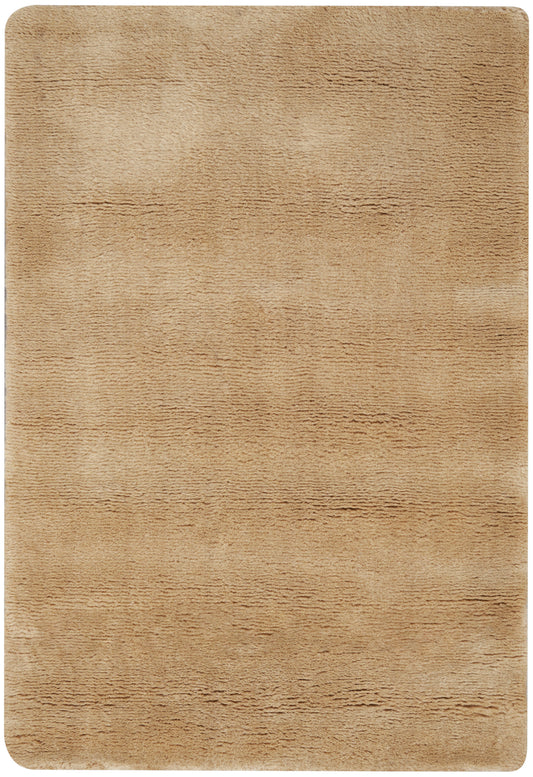 Tan plush rug with soft, textured pile and rounded corners.
