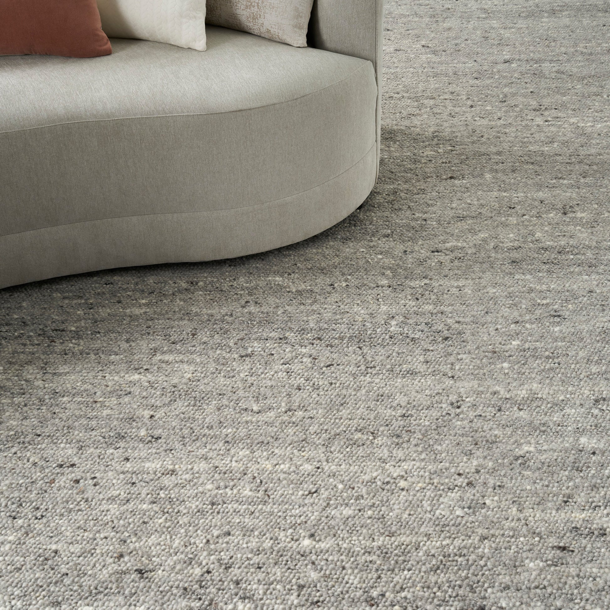 Light gray textured farmhouse area rug, 6' x 8'.