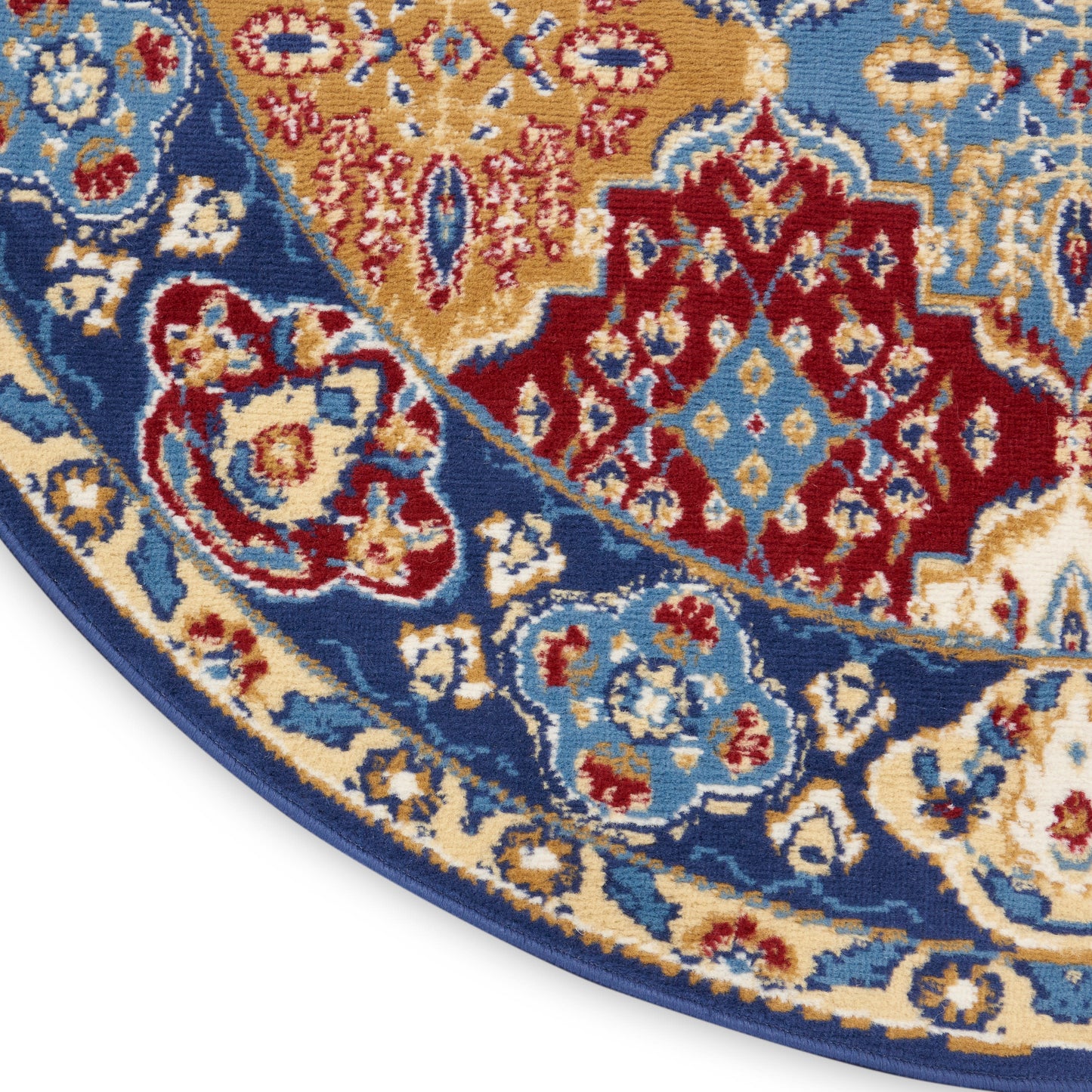 Round Bohemian-style rug with a blue border and a gold, red, and cream floral medallion pattern.