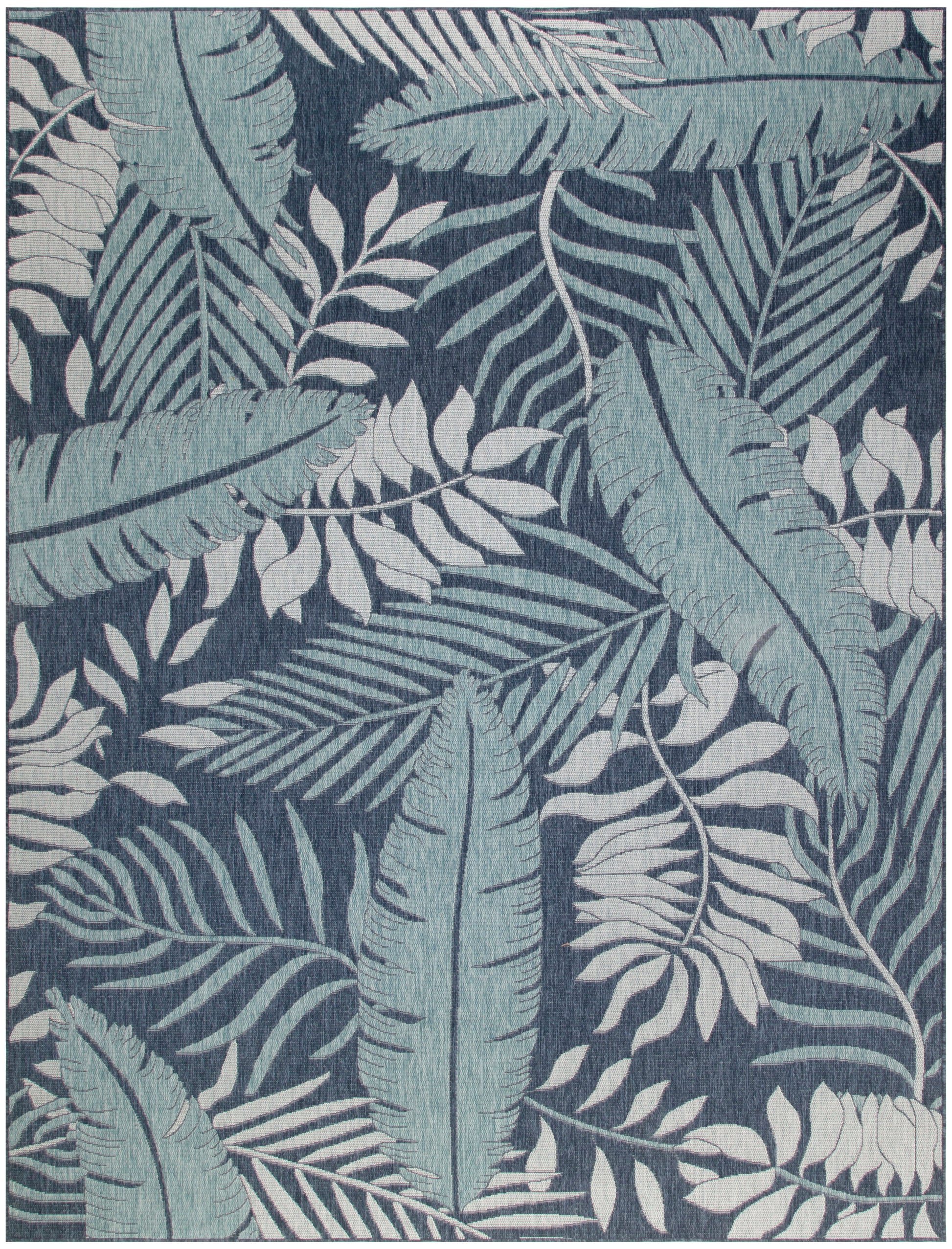 Dark navy rectangular rug with teal and pale blue tropical leaf pattern; woven botanical design for living room.
