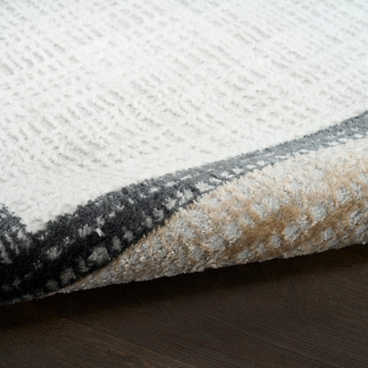 Textured high-pile rug in cream with a gray border; folded corner shows beige underside on dark wood floor.