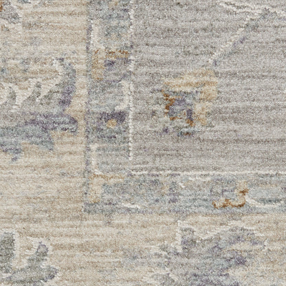Distressed vintage-style area rug in beige, ivory and gray with soft lavender accents and subtle oriental floral pattern.