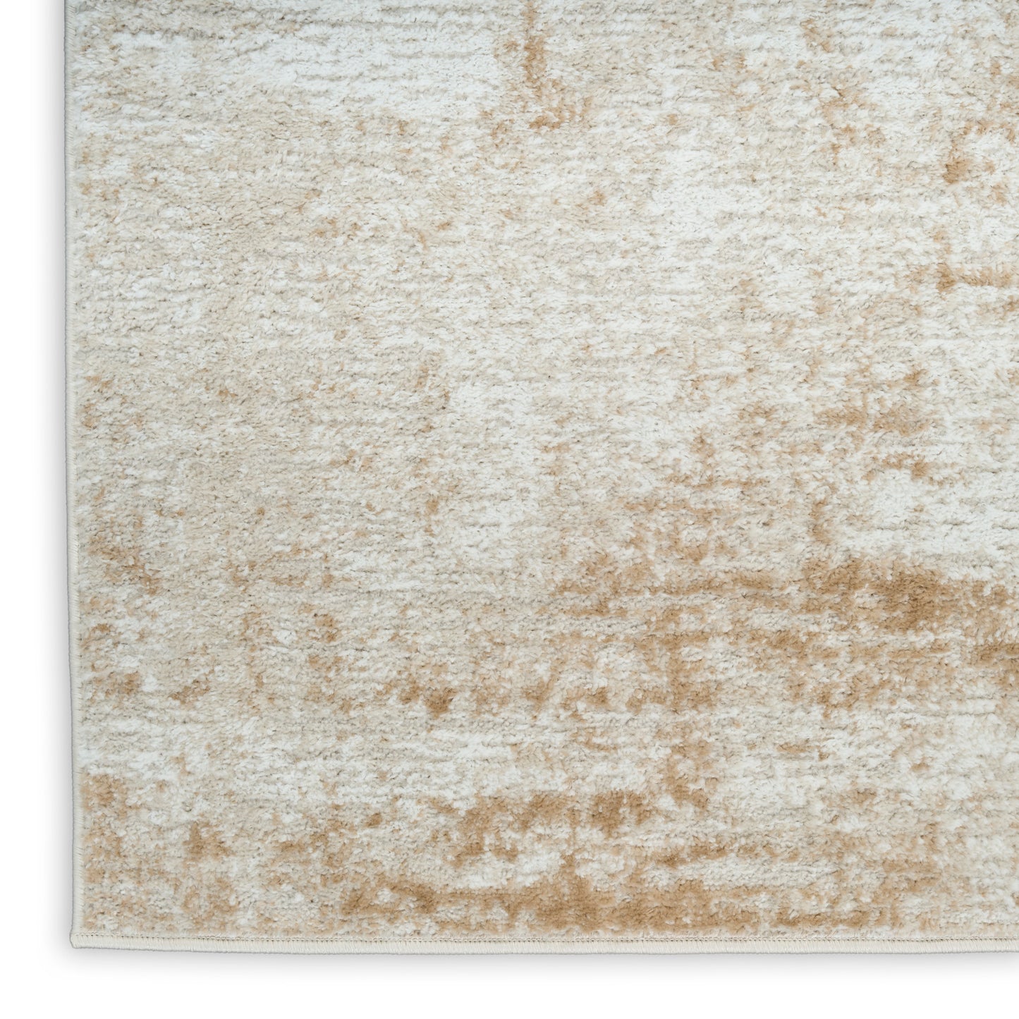 Beige and ivory plush area rug with soft pile and subtle abstract pattern.