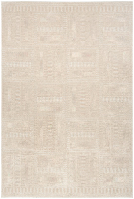 Beige rectangular area rug with a subtle patchwork geometric pattern and soft woven texture.