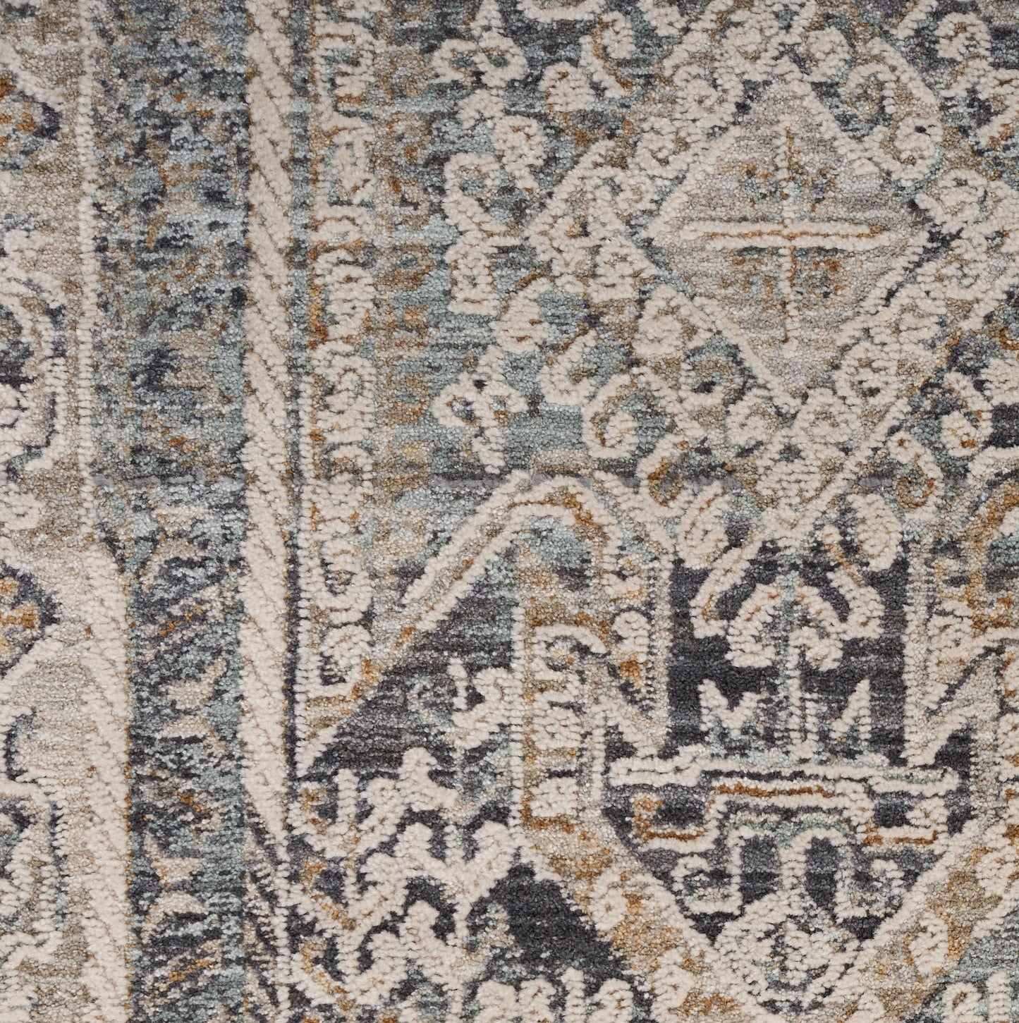 Blue-gray oriental rug with ivory medallion and floral motifs; distressed vintage wool rug.