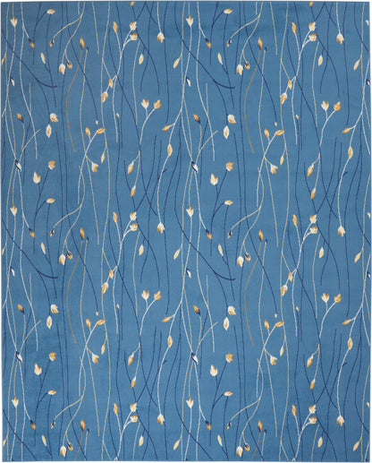Blue textile rug with sinuous white and navy stems and tiny golden leaves.