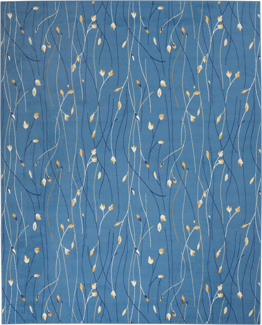 Blue textile rug with sinuous white and navy stems and tiny golden leaves.