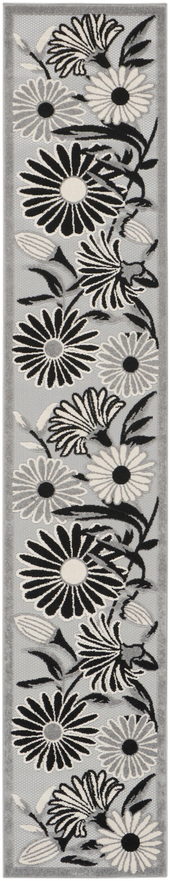 Grey floral runner rug featuring large black-and-white daisies and leaves.