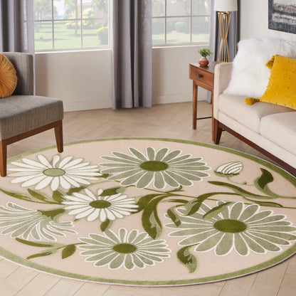 Round floral area rug with white daisies and green leaves on beige, green edge, in a cozy living room.