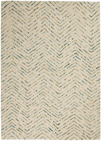 Beige shag rug with blue-green chevron zigzag pattern; plush pile, rectangular, coastal boho style, 4' x 6'.