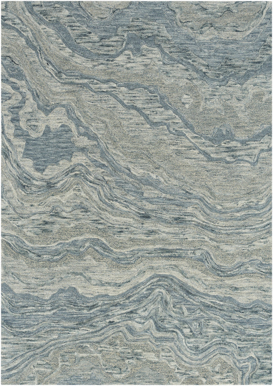 Blue-gray abstract marbled rug with beige swirls, soft textured pile for modern living spaces.