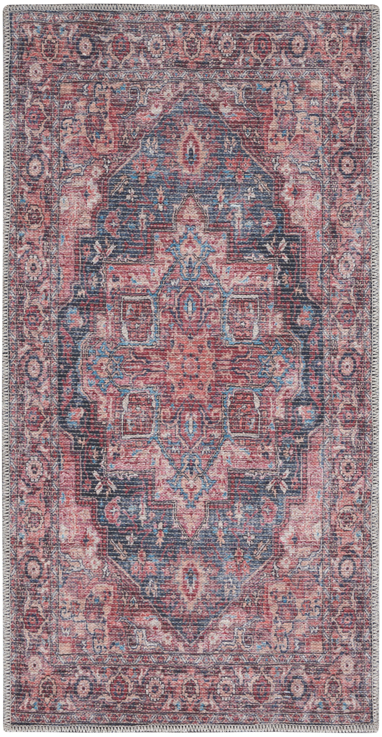 Rectangular vintage-style Persian rug in pink, navy and cream with a richly detailed central medallion and ornate border.