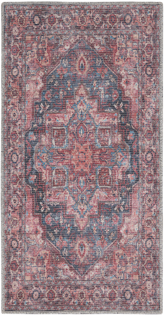 Rectangular vintage-style Persian rug in pink, navy and cream with a richly detailed central medallion and ornate border.