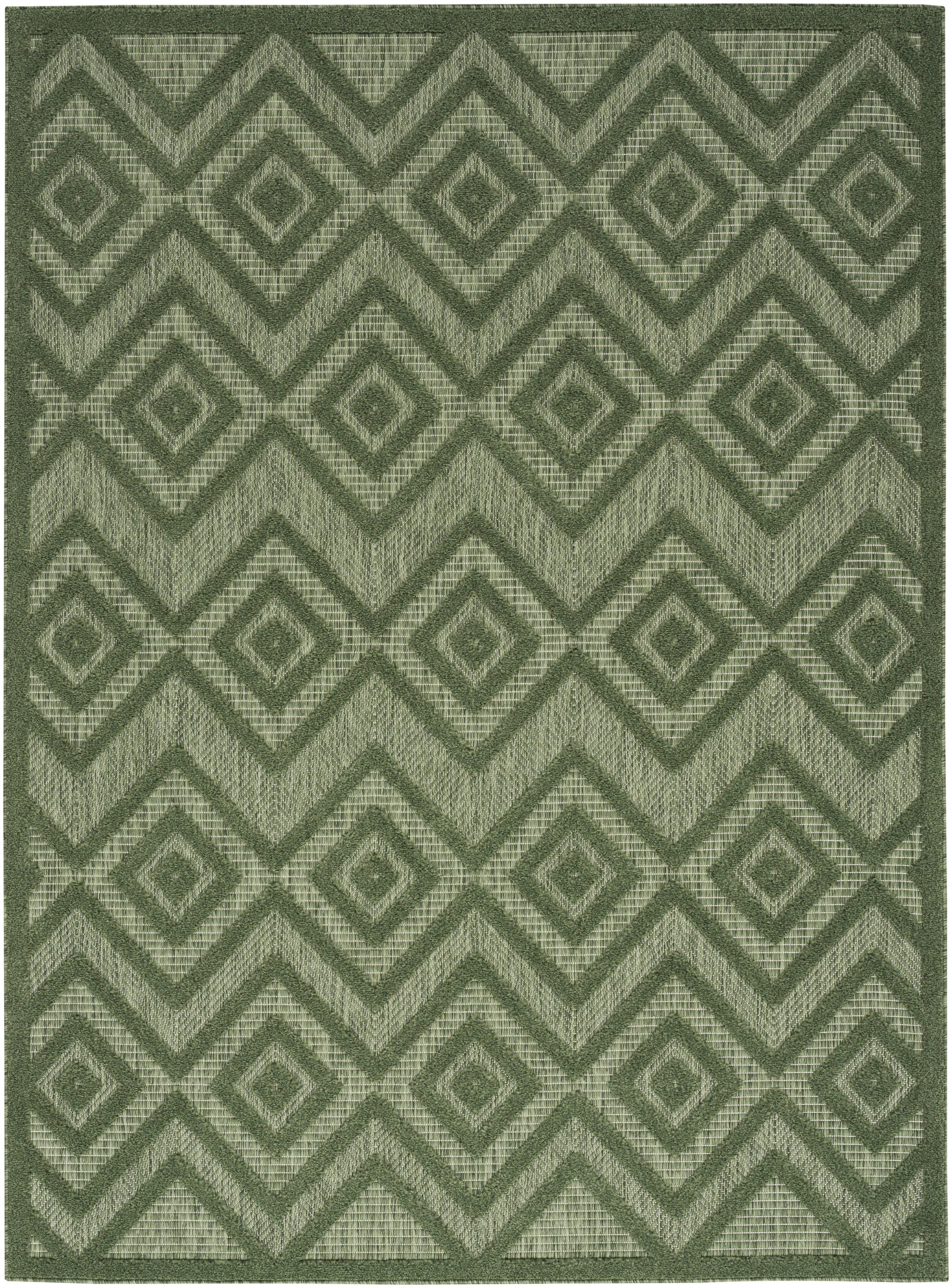 Green woven rectangular rug with interlocking diamond and chevron motif in olive tones; geometric tribal style.
