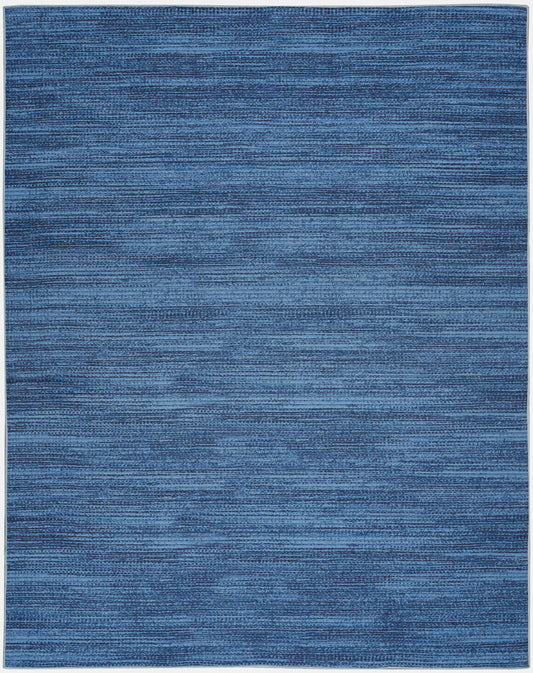 Rectangular blue area rug with subtle horizontal stripe texture and soft woven look.