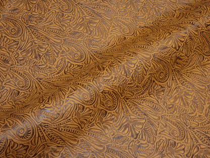 Camel cowhide leather with an alligator-embossed pattern and hand-tipped finish.