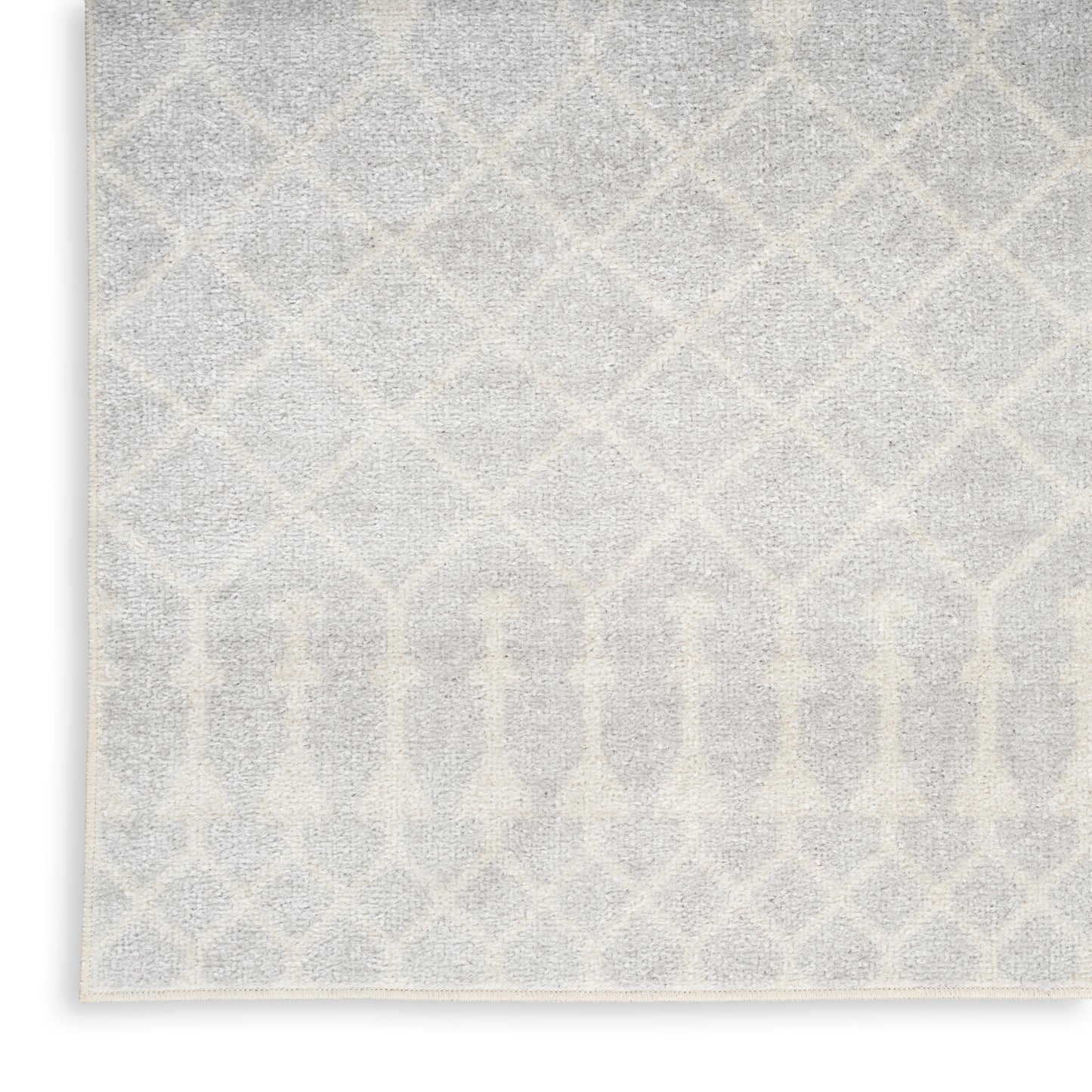 Soft gray and ivory area rug with a geometric lattice diamond pattern; plush pile and rectangular shape.