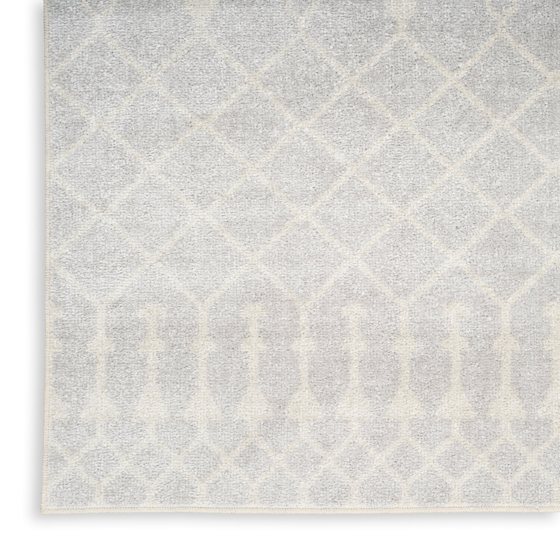Soft gray and ivory area rug with a geometric lattice diamond pattern; plush pile and rectangular shape.