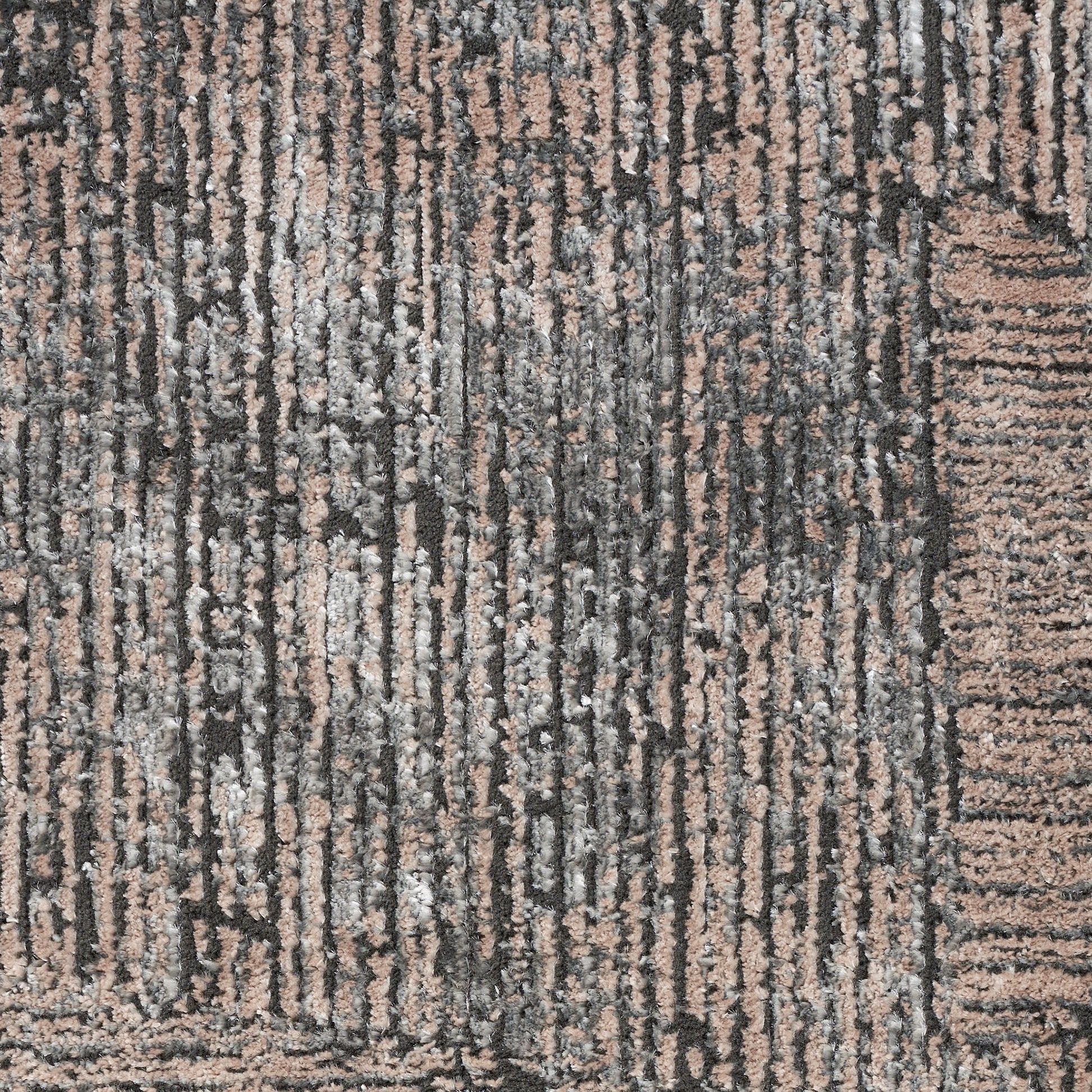 Close-up of a gray and beige striped area rug with vertical lines and soft woven texture for modern living spaces.