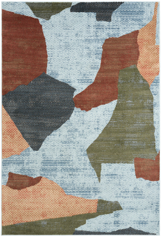 Abstract area rug with irregular color blocks: light blue base with orange, olive green, navy and taupe shapes.