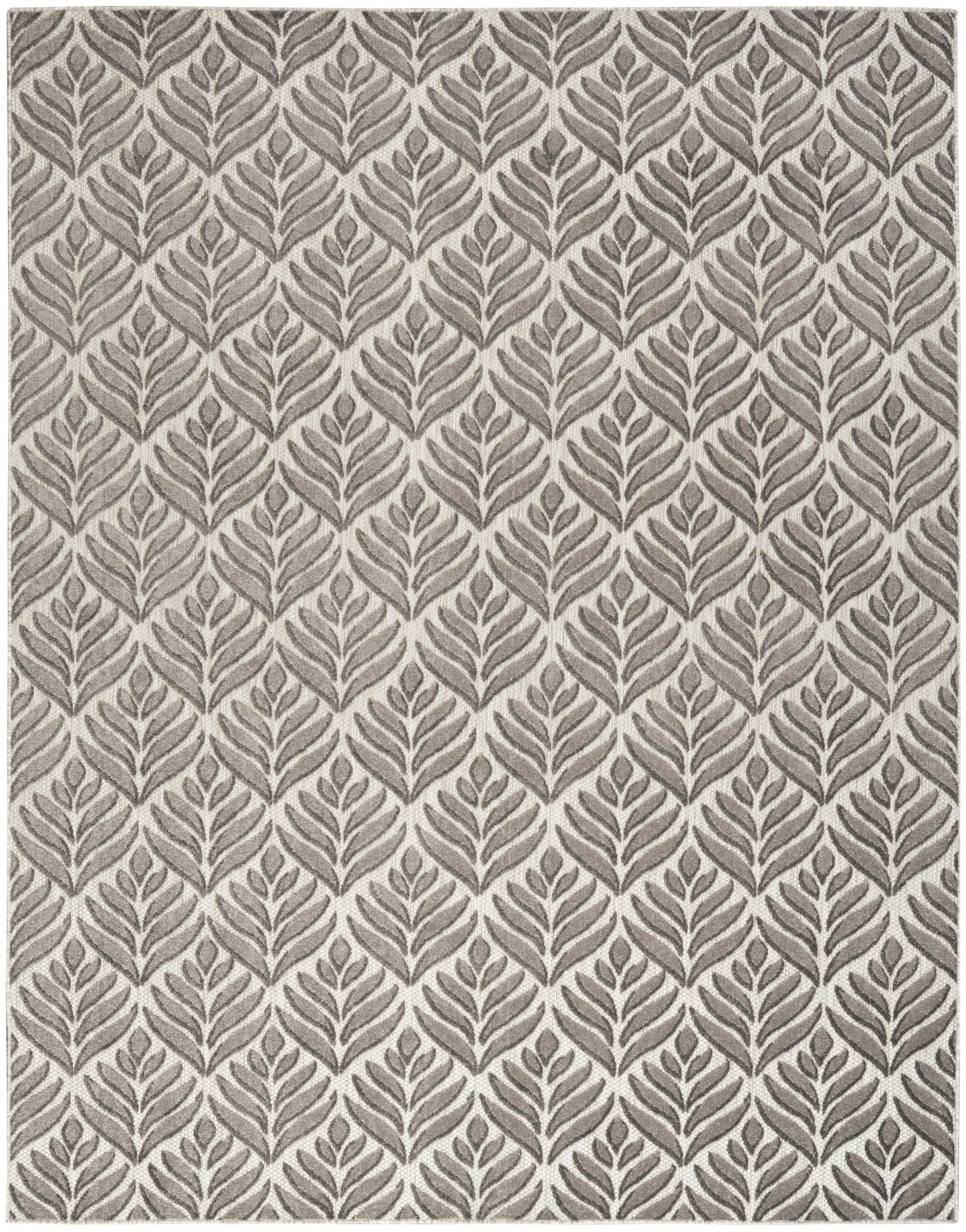 Neutral beige rug with a repeating taupe leaf pattern in a modern botanical style.