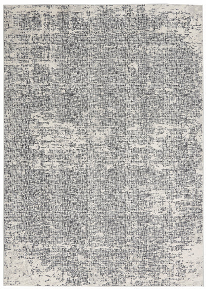Rectangular rug with a distressed gray and charcoal speckle pattern.