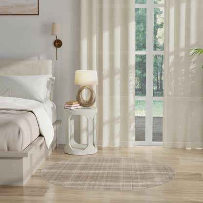 Bright modern bedroom with white bedding, sculptural white nightstand, round glass lamp, sheer curtains, round rug.