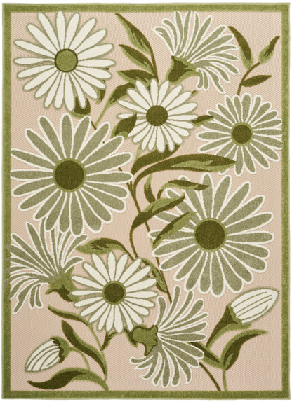 Rectangular rug with large white daisies, green centers and leaves on a pale pink background, bordered in green