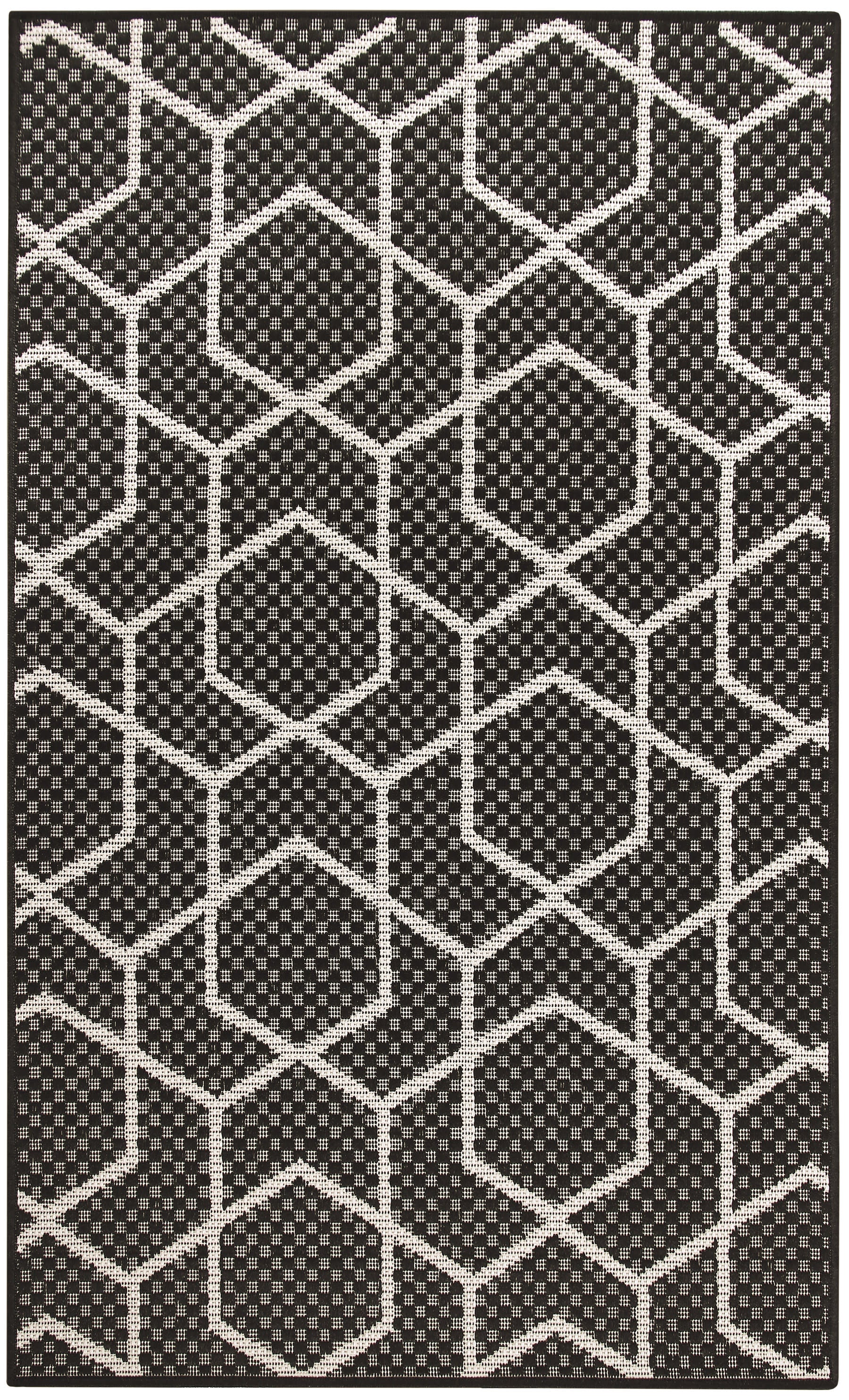 Black and white geometric rug with interconnected hexagons and dotted interiors; modern flat-weave style.
