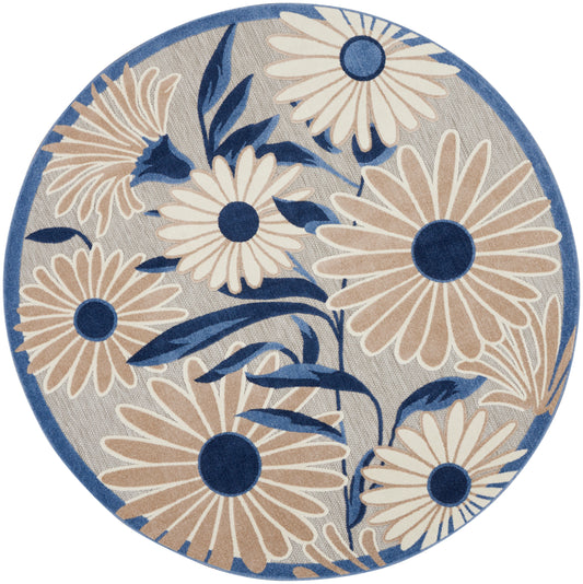 Round rug featuring cream daisies with navy centers on light gray, blue border woven floral pattern.