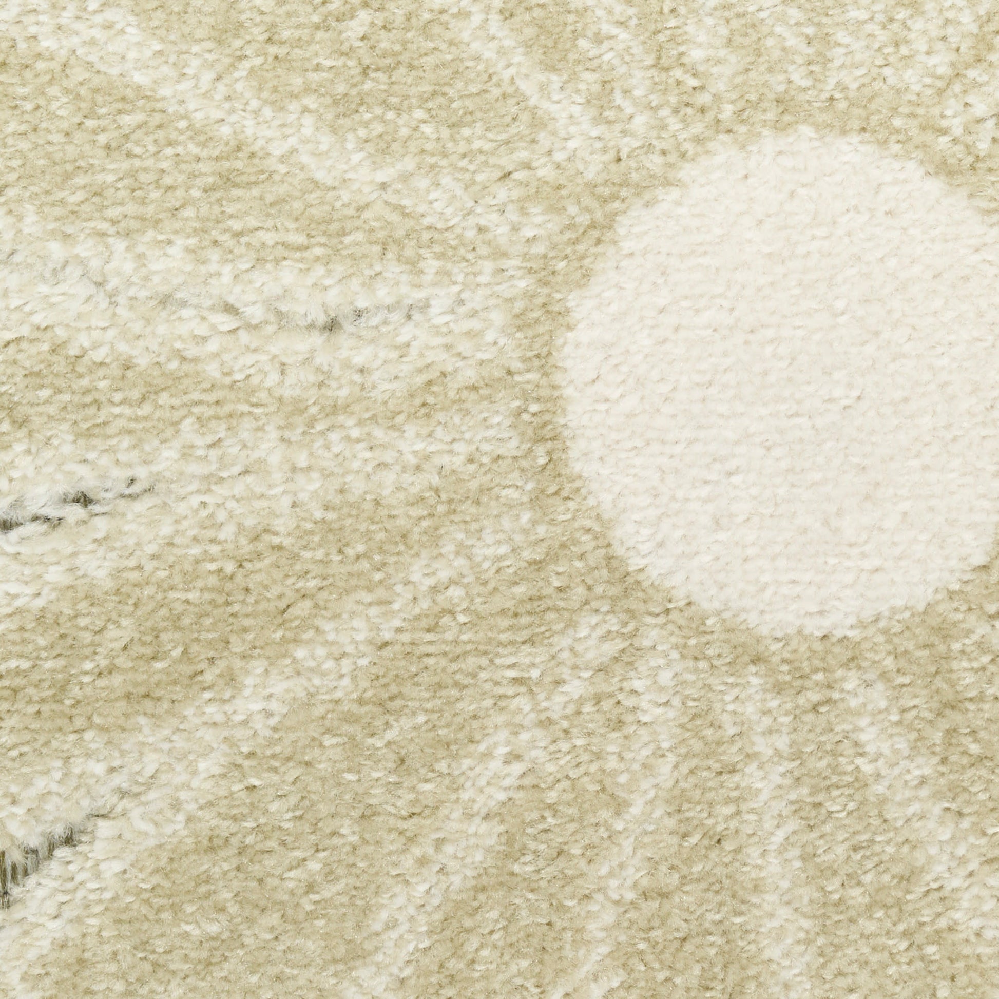 Beige shag rug with large cream circle pattern, plush pile, cozy living room decor.