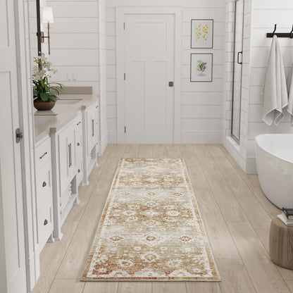 Long cream-brown ornate patterned bathroom runner rug on light wood floor beside white vanity and freestanding tub.