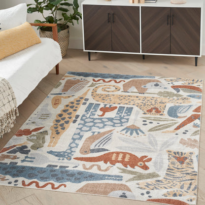 Abstract patterned area rug in blue, tan and coral tones; soft pile for a modern boho living room.