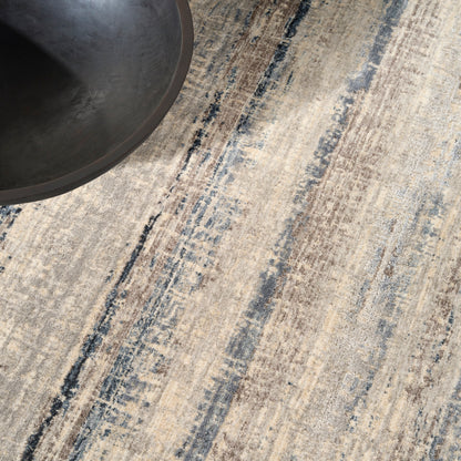 Beige and blue textured rug with a visible woven pattern.
