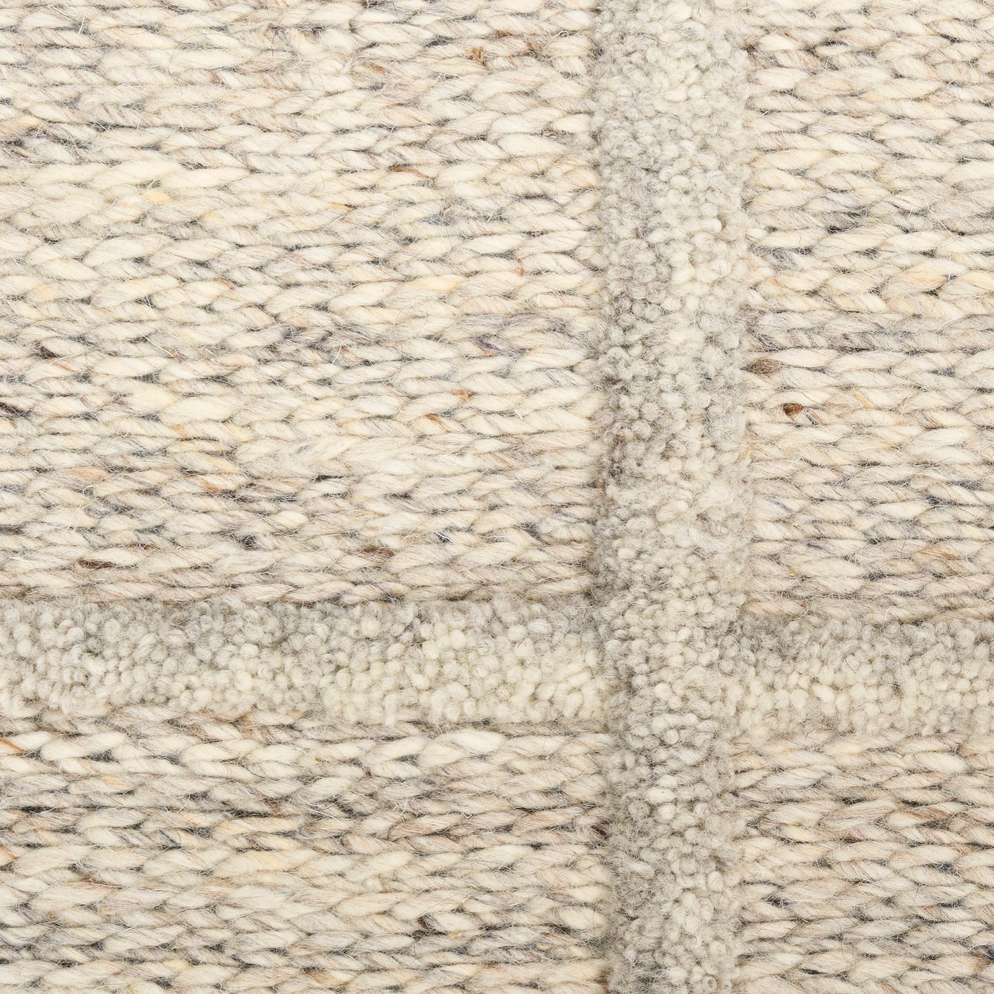 Cream-beige soft chunky-knit textile rug with boucle texture and a woven grid pattern.